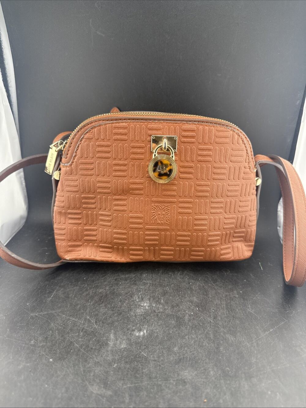 Anne Klein Embossed Logo Dome Crossbody Bag Brown Leather Gold Padlock Lion AK